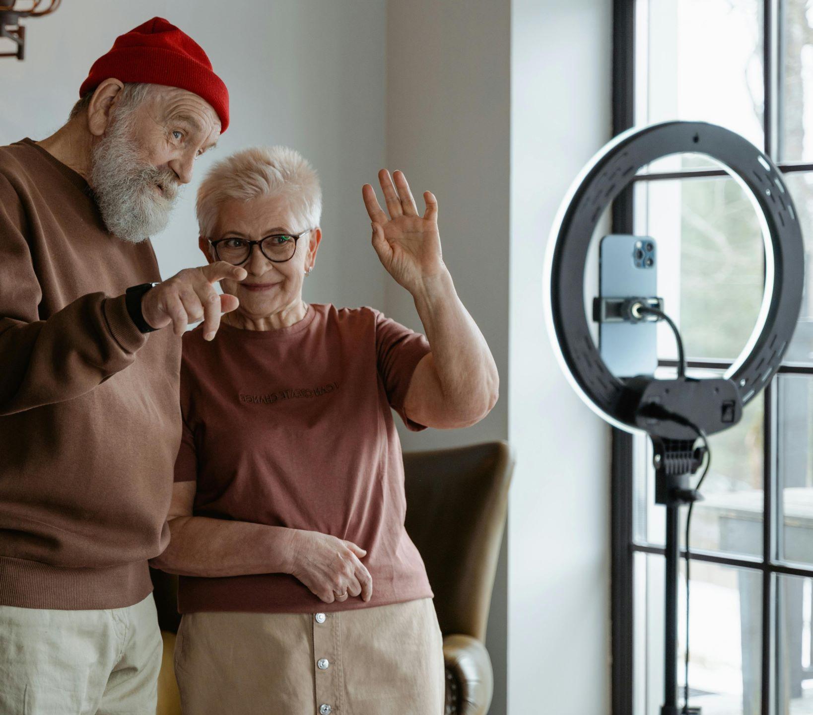 An elderly couple video chatting