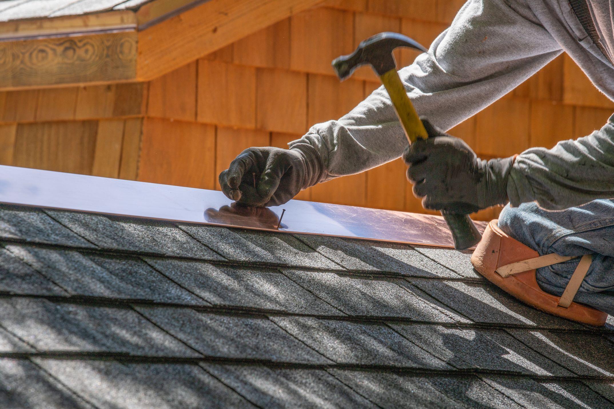 A contractor working on a roof